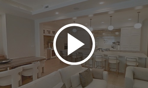 a play button on top of an image of a kitchen